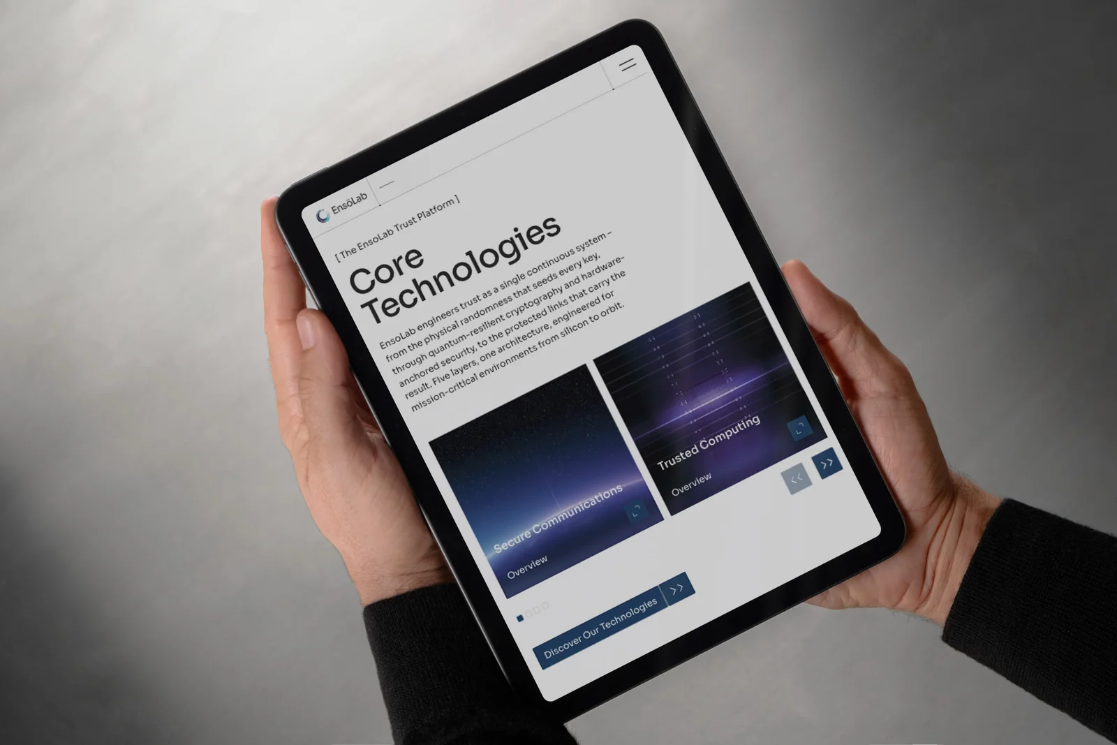 The EnsoLab core technologies page on a tablet, held in both hands