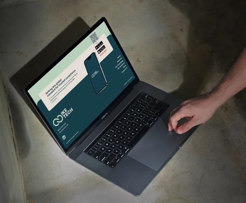 The IKE Tech footer on a laptop