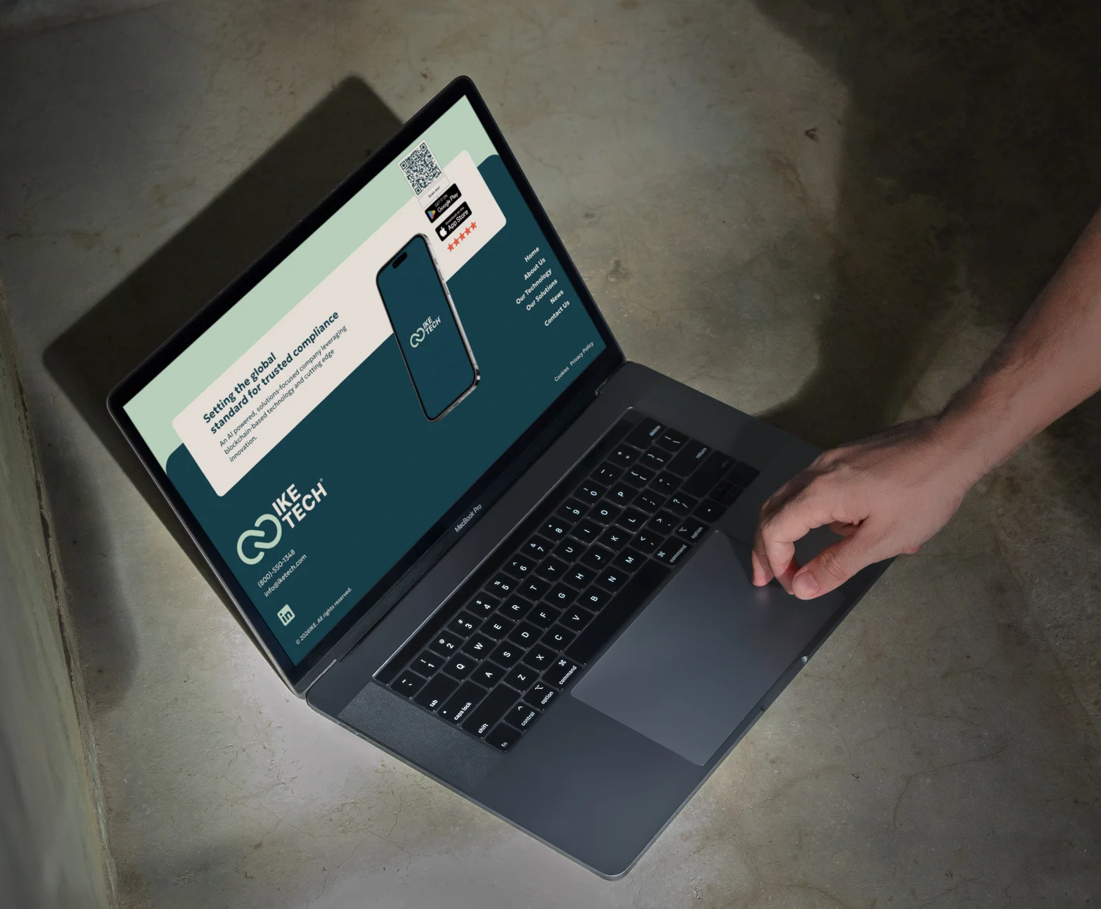 The IKE Tech footer on a laptop