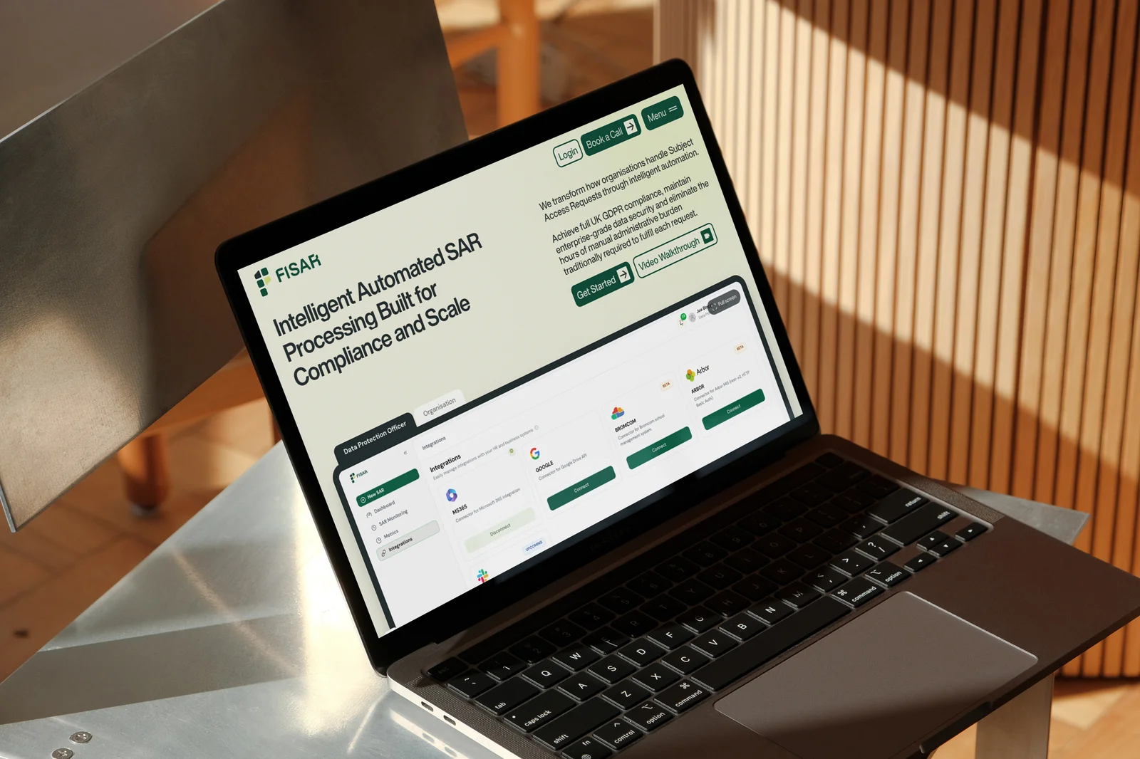 The Fisar homepage on a laptop