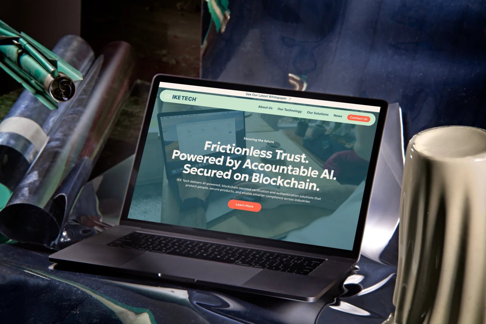 The IKE Tech homepage on a laptop