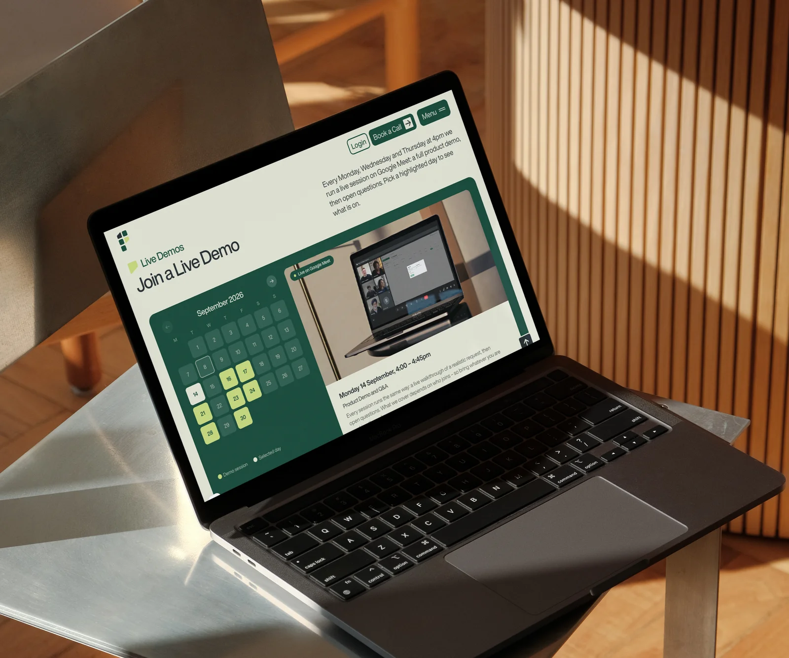 The Fisar live demo booking page on a laptop