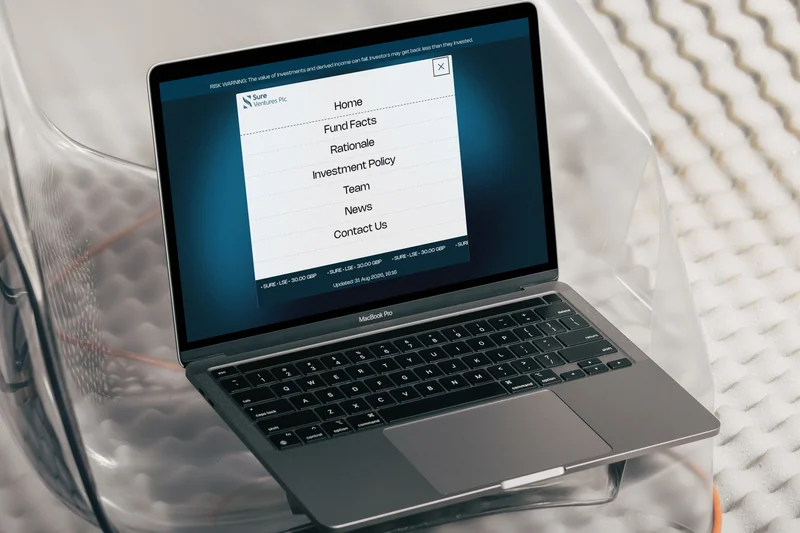 The Sure Ventures PLC navigation menu open on a laptop