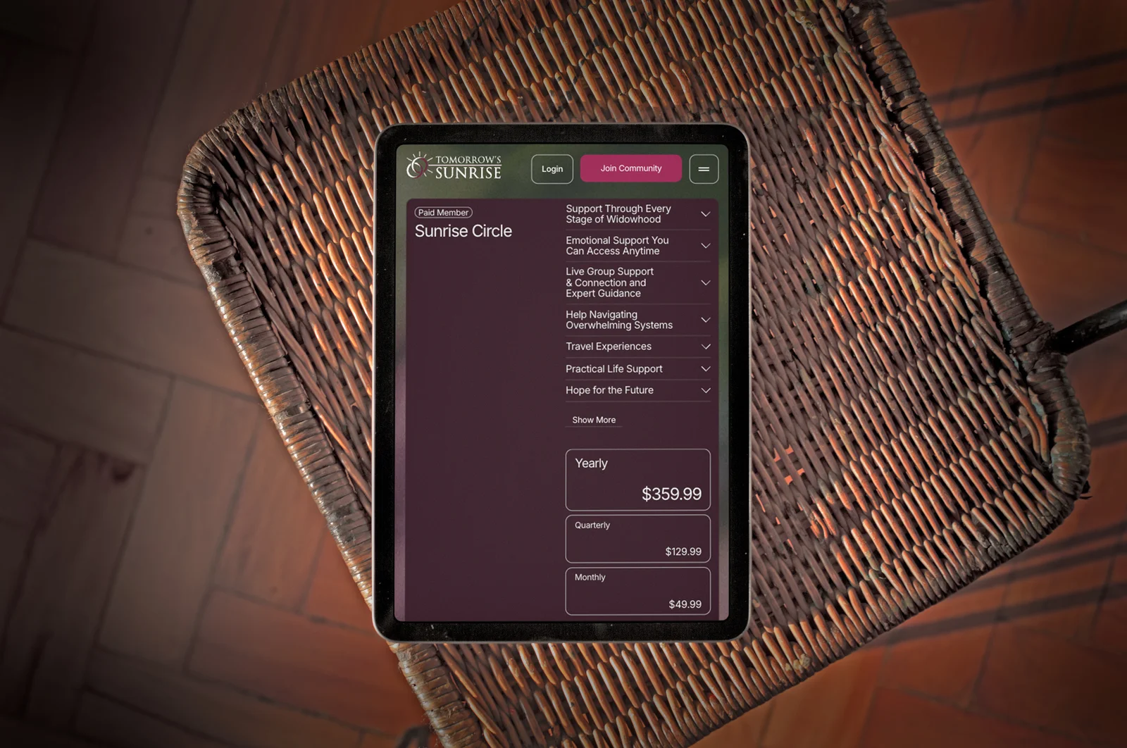 The Sunrise Circle membership on a tablet, on a wicker seat