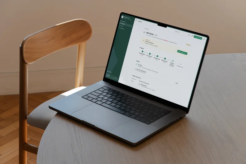The Fisar platform dashboard on a laptop, on a wooden chair